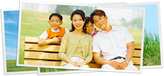 photo of family sitting on bench in park